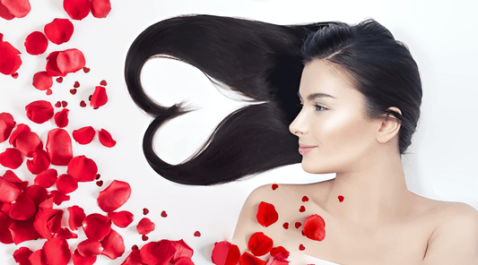 Girl with long heart shaped hair on bed of rose petals