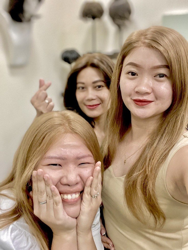Three clients at the HEADS wig studio in Makati