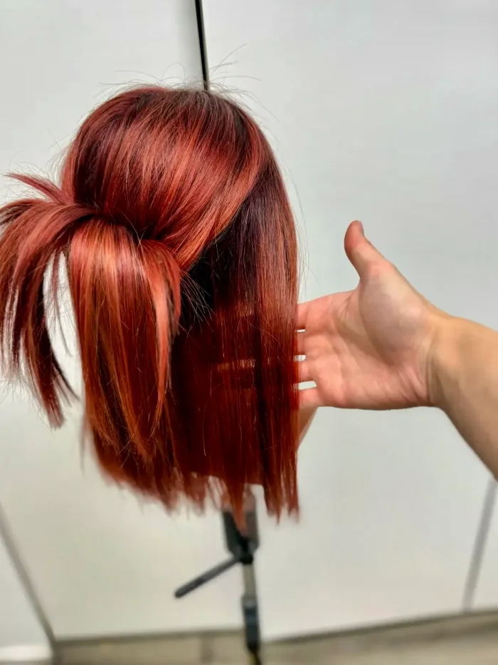 Hand-knotted auburn bob wig by HEADS on a stand, before fitting