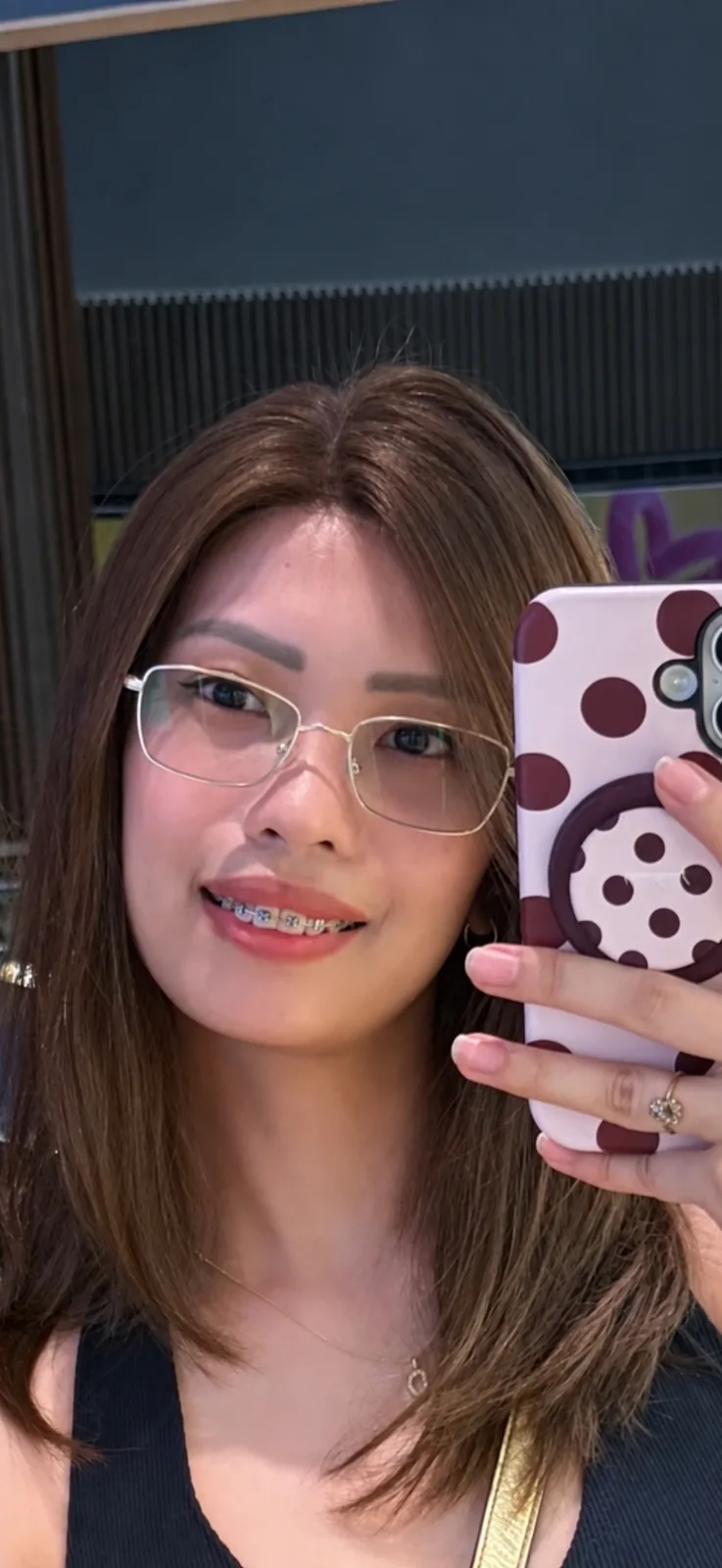 Mirror selfie in a brown lob human-hair wig with glasses