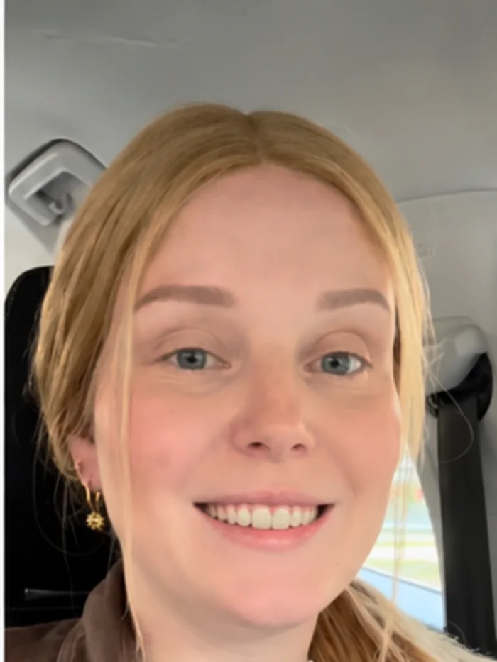 HEADS client wearing a blonde human-hair wig on an ordinary day