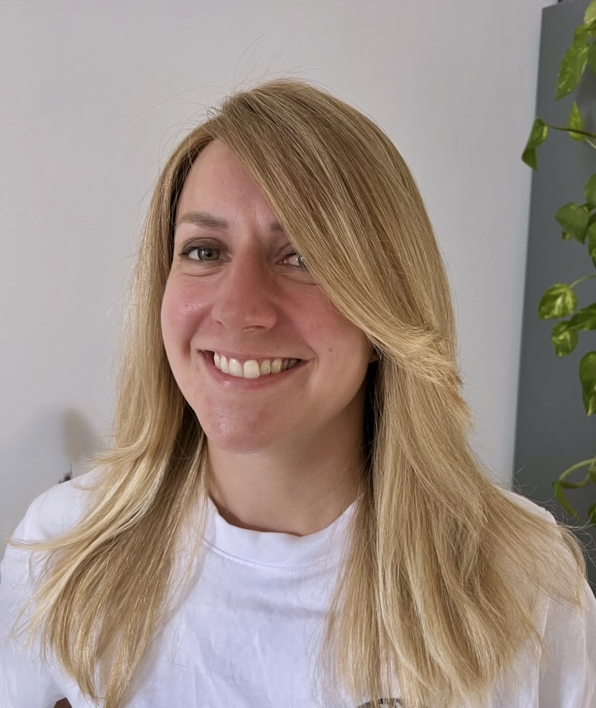 HEADS client wearing a long blonde human-hair wig
