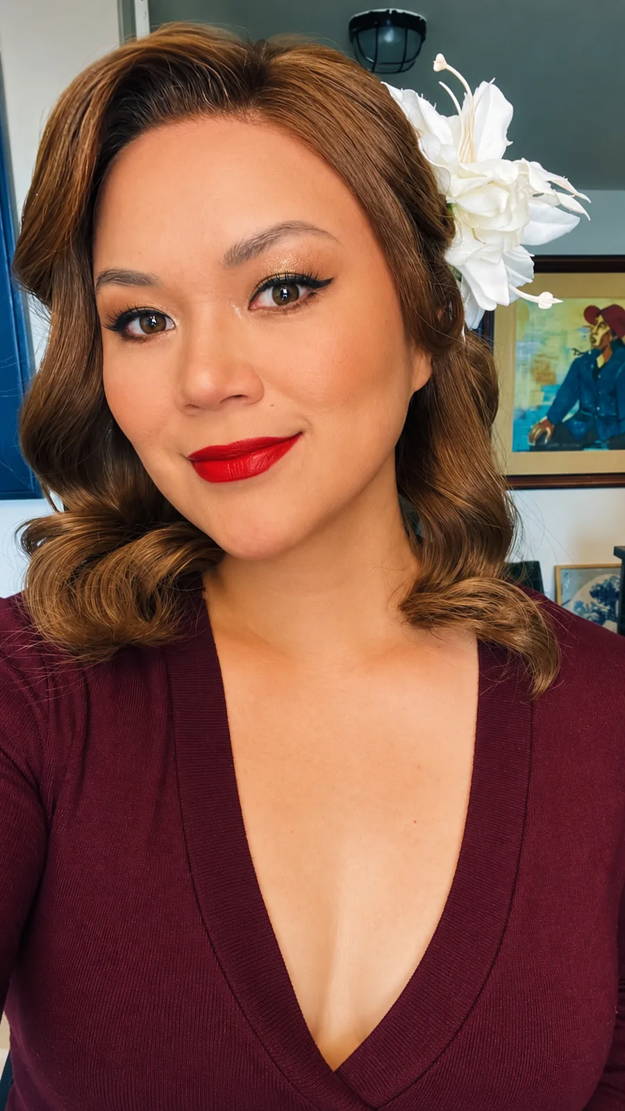 Old-Hollywood curls in a brunette human-hair wig, burgundy dress