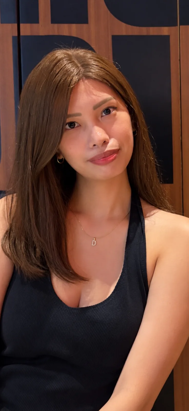 Long copper-brown human-hair wig, indoors