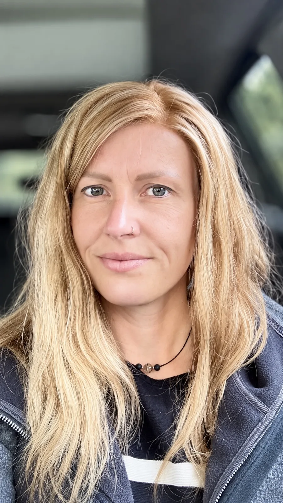 Mature client in a long straight blonde human-hair wig, in the car