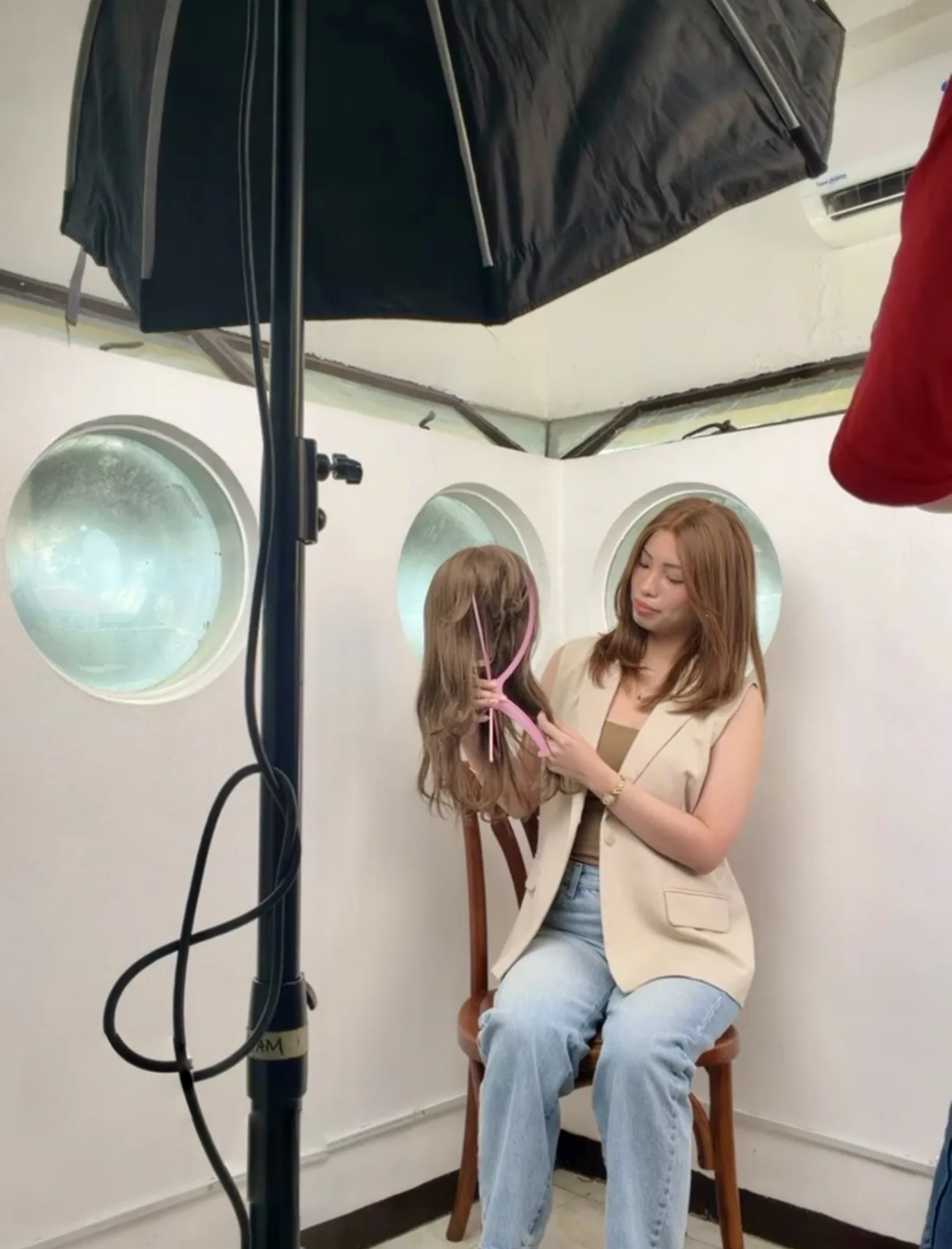 Behind the scenes of a HEADS wig photo shoot with studio lighting in Makati