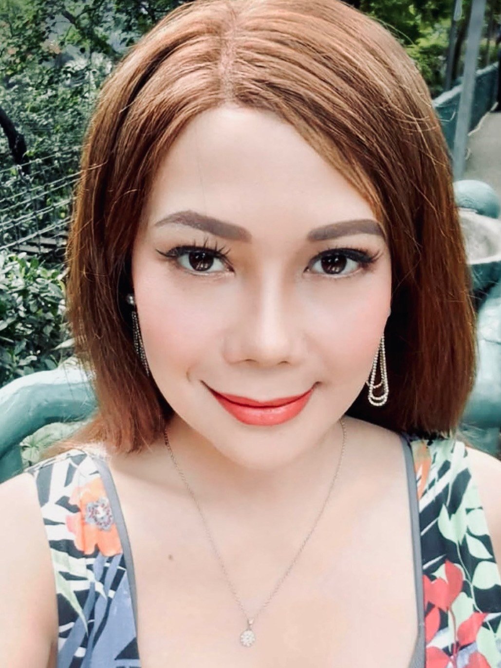 Kristine Legacion wearing a different HEADS wig — auburn bob