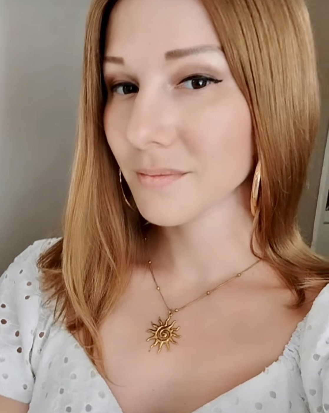 Sleek copper human hair wig with a natural parting