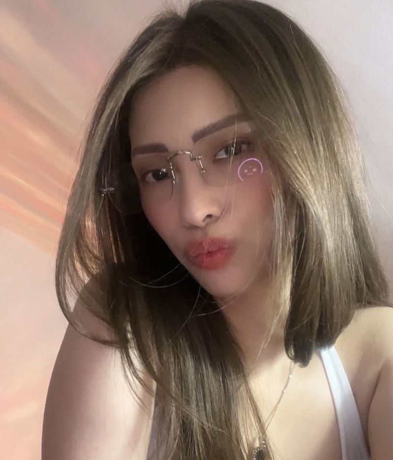 Filipina client in a long straight human hair wig, rimless glasses
