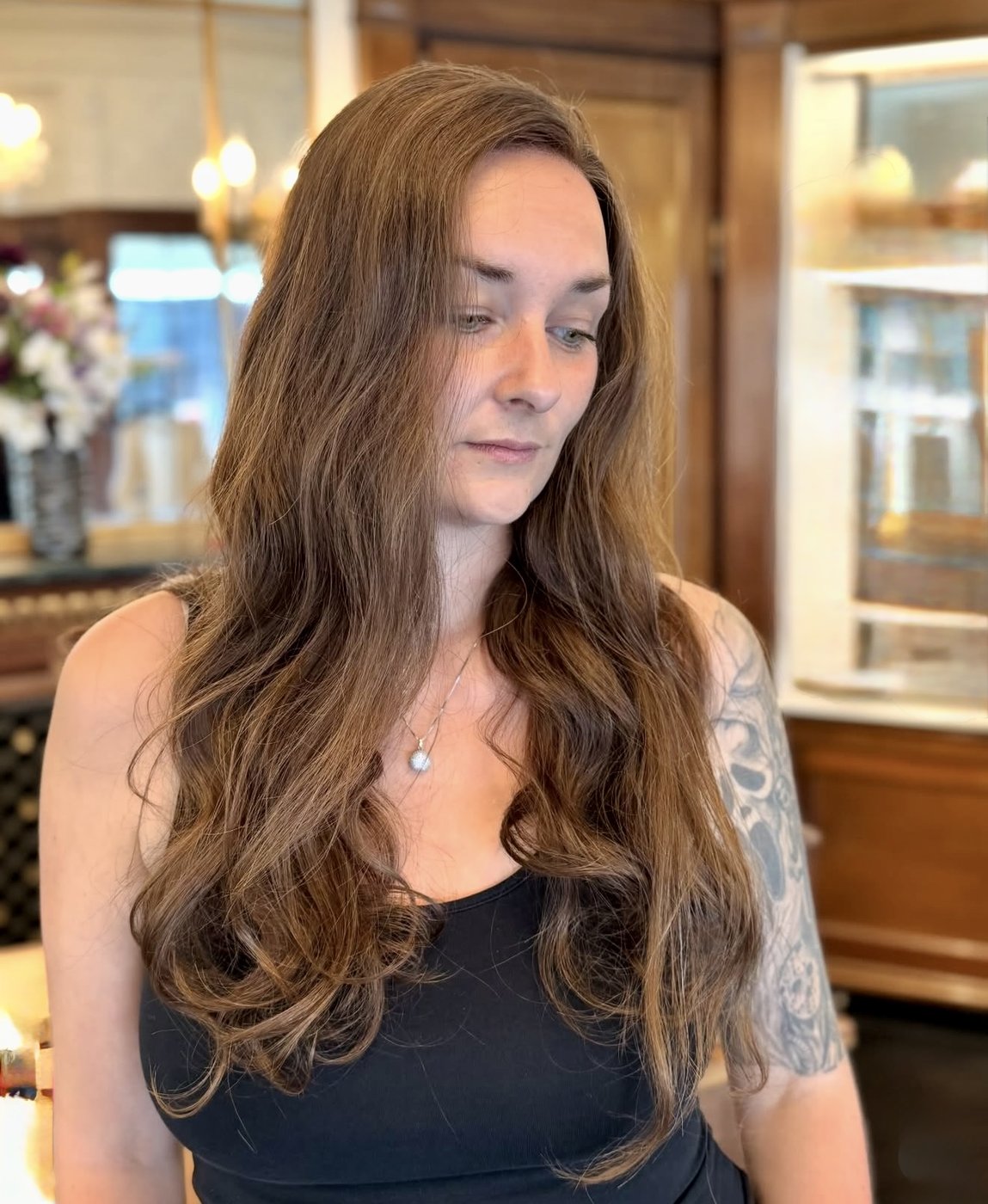 Long brown human hair wig freshly styled at the salon