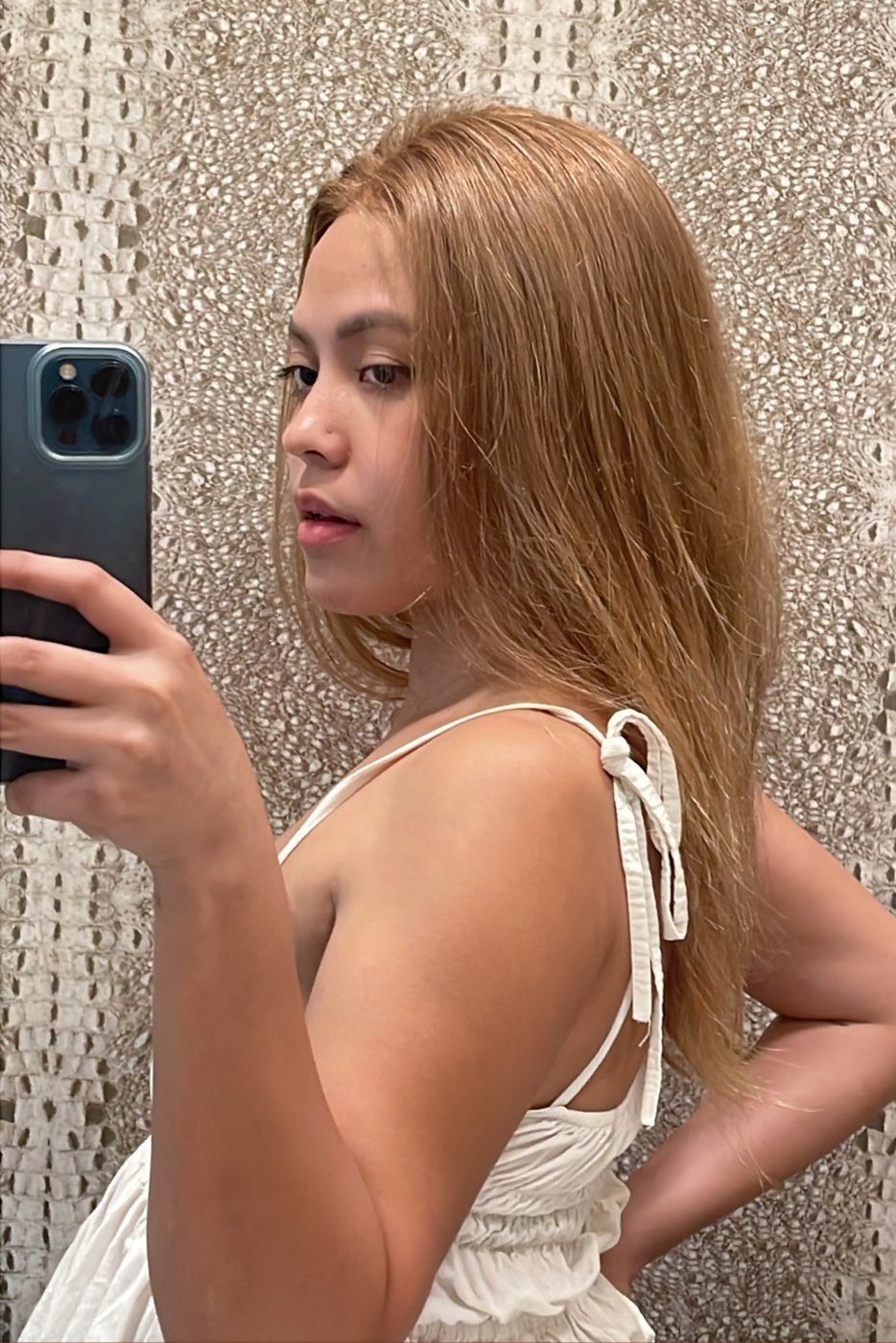 Strawberry blonde long wig side profile showing natural hairline