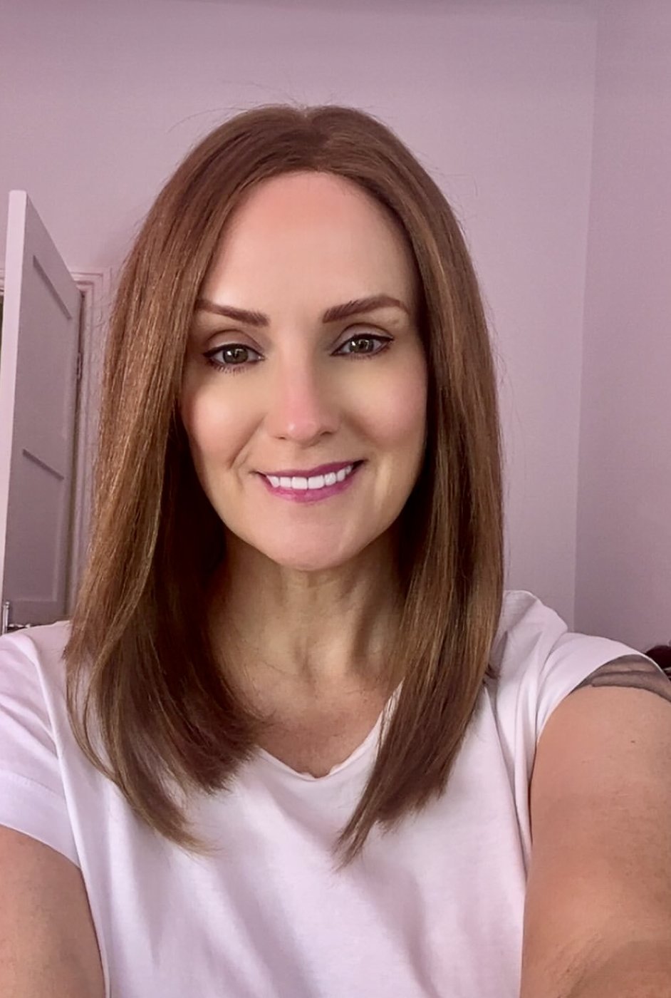 The same woman in a warm chestnut lob human hair wig