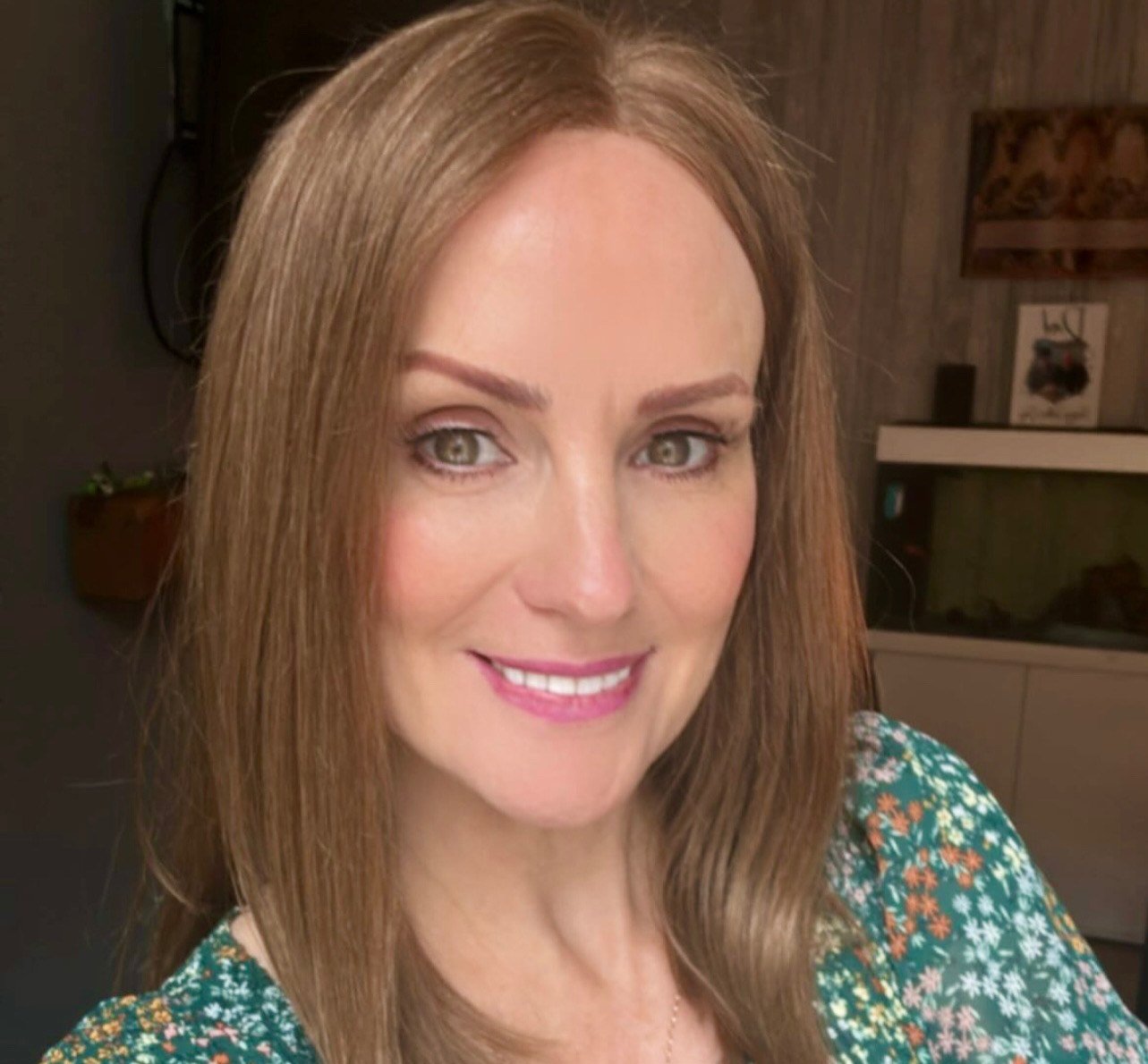 The same woman in a long straight human hair wig